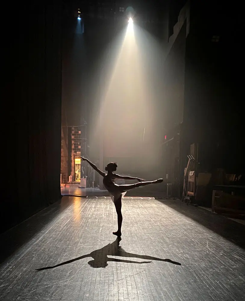 Ballerina on stage in the spotlight